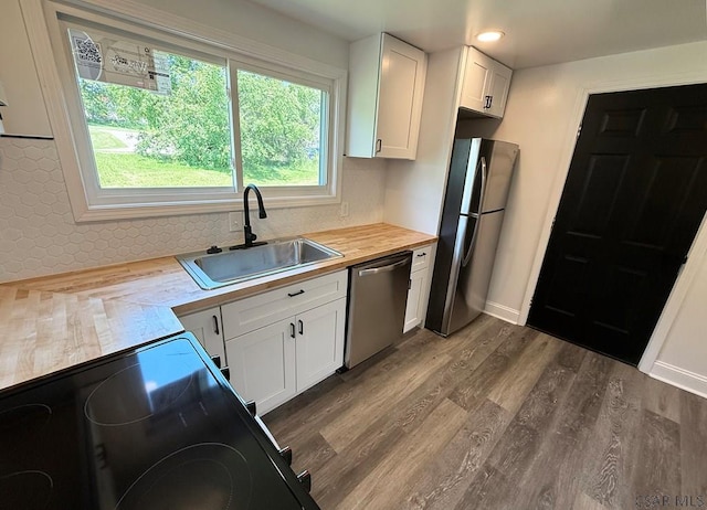 247 Jefferson Ave, Windber, PA 15963 - kitchen featuring appliances with stainless steel finishes, butcher block counters, dark wood-type flooring, white cabinetry, and recessed lighting