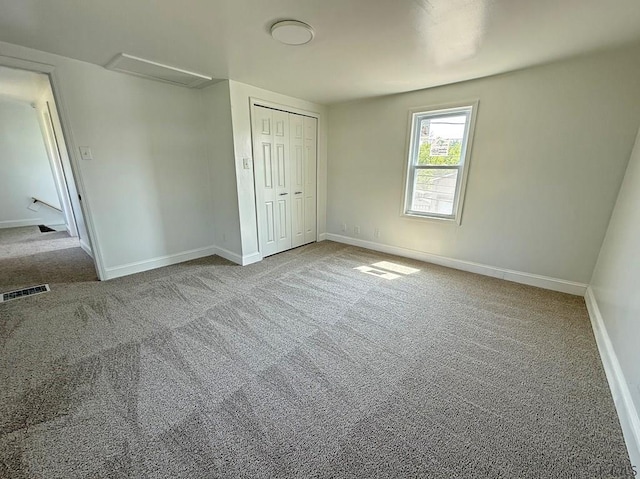 247 Jefferson Ave, Windber, PA 15963 - unfurnished bedroom with carpet floors, attic access, and a closet
