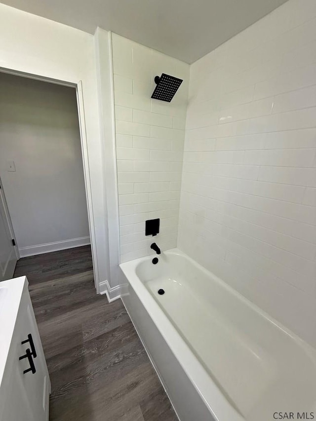 247 Jefferson Ave, Windber, PA 15963 - bathroom featuring wood finished floors, shower / bathtub combination, and vanity