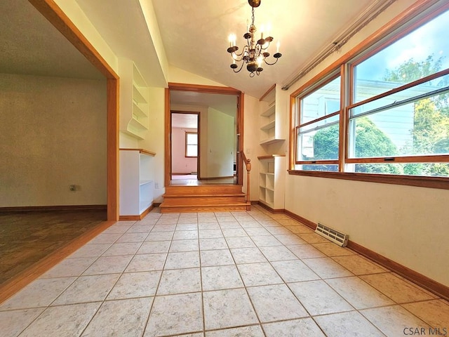 2139 Woodcrest Dr, Johnstown, PA 15905 - spare room with a chandelier, vaulted ceiling, baseboards, and light tile patterned floors