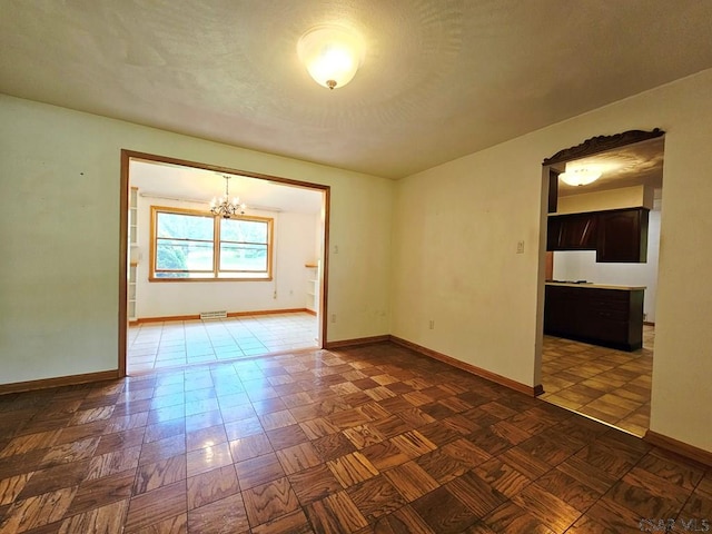 2139 Woodcrest Dr, Johnstown, PA 15905 - unfurnished room with a chandelier and baseboards