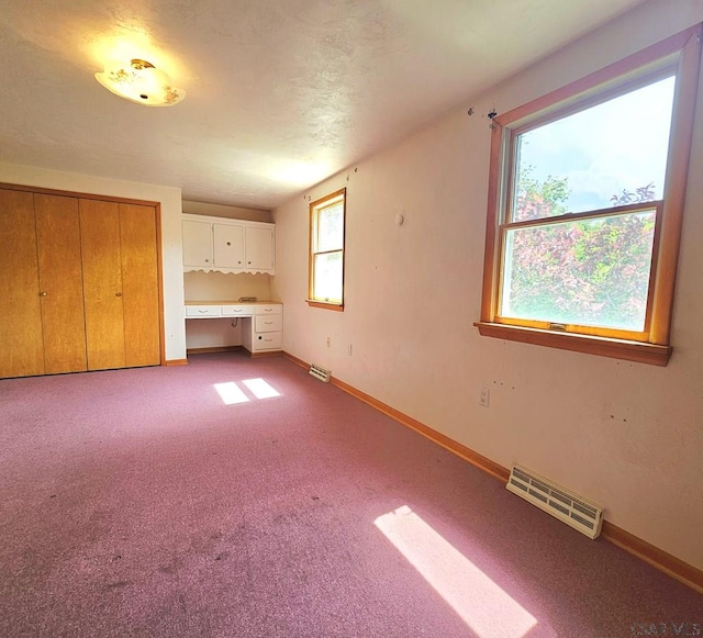 2139 Woodcrest Dr, Johnstown, PA 15905 - unfurnished living room with baseboards and light carpet