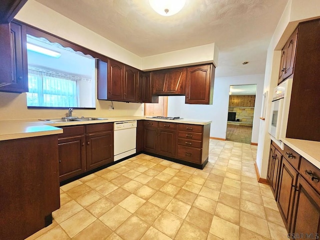 2139 Woodcrest Dr, Johnstown, PA 15905 - kitchen featuring white appliances, a sink, light countertops, baseboards, and dark brown cabinetry