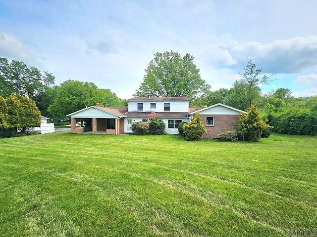 2139 Woodcrest Dr, Johnstown, PA 15905 - rear view of property with a yard and brick siding