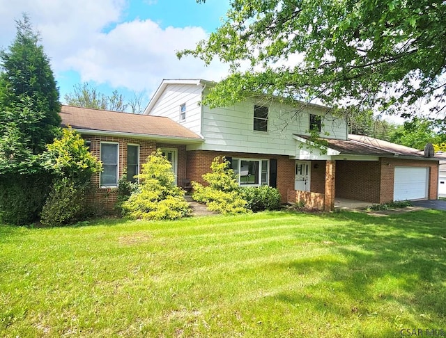 2139 Woodcrest Dr, Johnstown, PA 15905 - view of front of home with brick siding, a garage, a front yard, and driveway