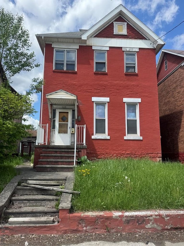 view of front of house with brick siding