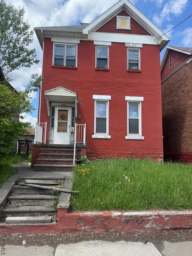 view of front of home with brick siding