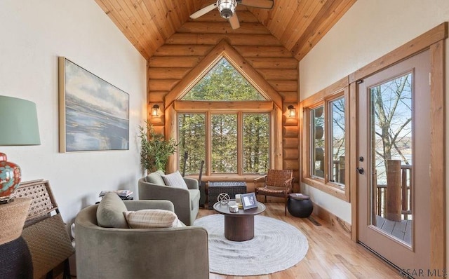 sunroom featuring ceiling fan, wooden ceiling, and lofted ceiling