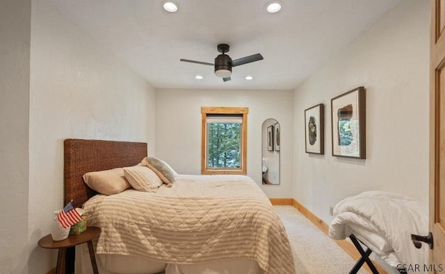 bedroom with recessed lighting, baseboards, light colored carpet, and a ceiling fan