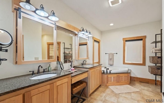 bathroom with a bath, visible vents, two vanities, and a sink