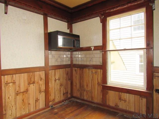 empty room with wood finished floors