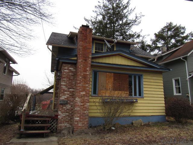 view of property exterior featuring a chimney