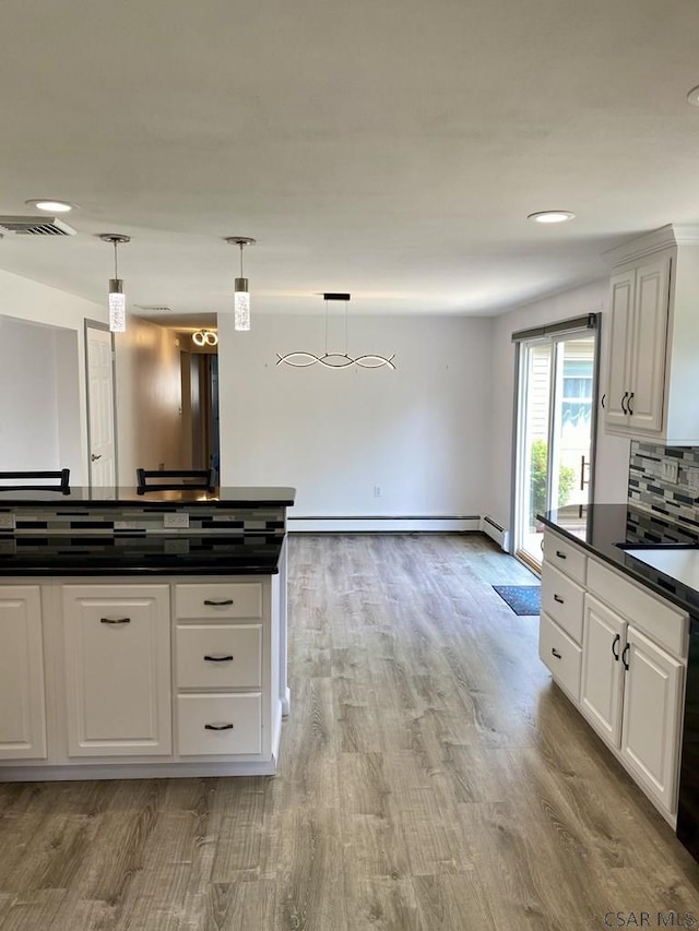 104 Erin Rd, Johnstown, PA 15905 - kitchen featuring dark countertops, a baseboard heating unit, light wood finished floors, white cabinets, and recessed lighting