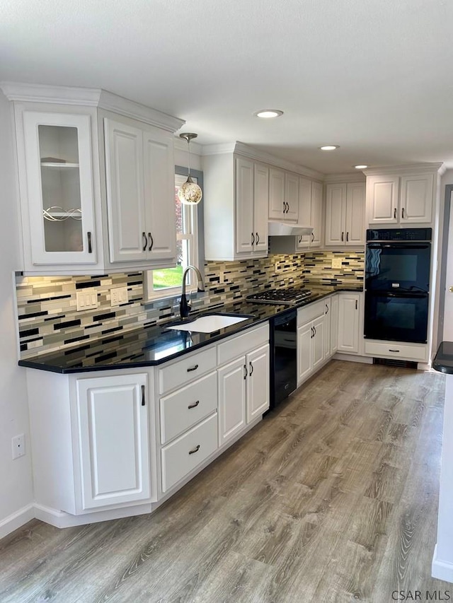 104 Erin Rd, Johnstown, PA 15905 - kitchen with a sink, under cabinet range hood, black appliances, dark countertops, and recessed lighting