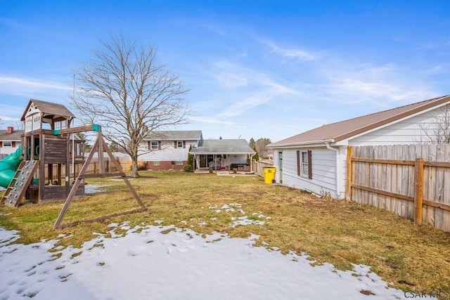 view of yard with a playground and fence