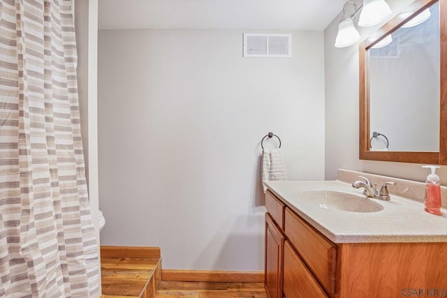 full bathroom with vanity, visible vents, and a shower with curtain