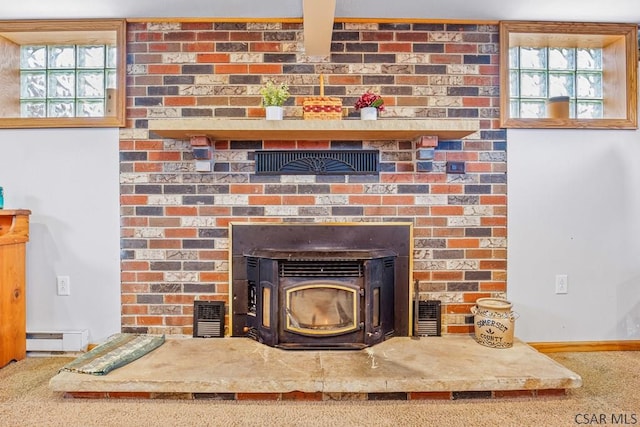 interior details featuring a wood stove, visible vents, a baseboard heating unit, and carpet flooring