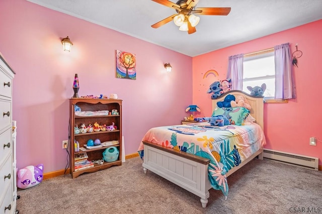 carpeted bedroom with a baseboard heating unit, ceiling fan, and baseboards