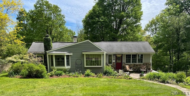 230 Trading Post Rd, Stoystown, PA 15563 - ranch-style house featuring a front yard, a chimney, stone siding, a shingled roof, and a porch