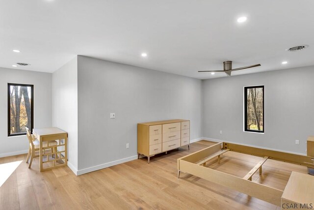 interior space with ceiling fan and light wood-type flooring