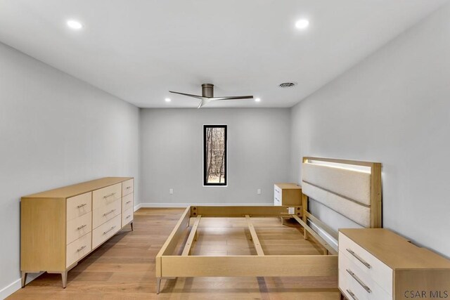 bedroom featuring ceiling fan and light hardwood / wood-style floors