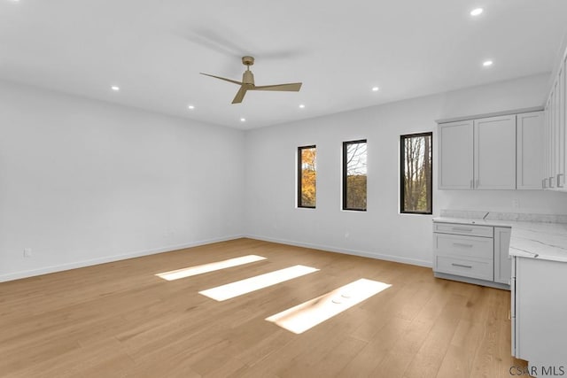 interior space with ceiling fan and light wood-type flooring