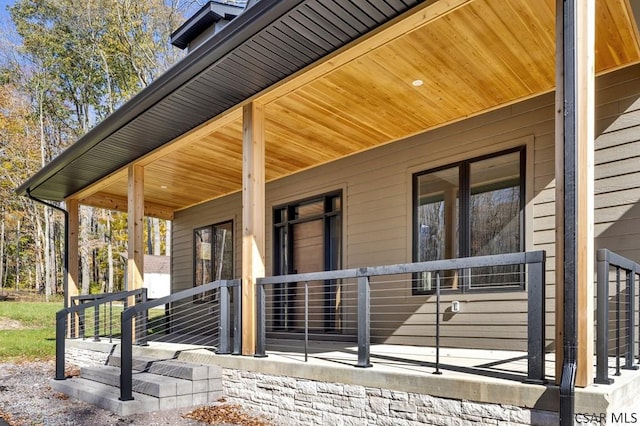 doorway to property featuring covered porch