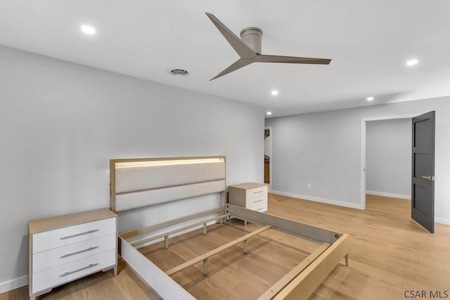 unfurnished bedroom featuring light wood-type flooring and ceiling fan