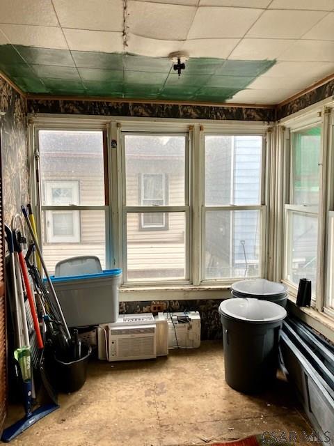 sunroom featuring a drop ceiling