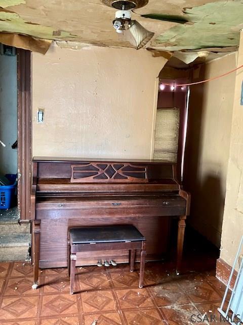 misc room featuring parquet floors and ceiling fan