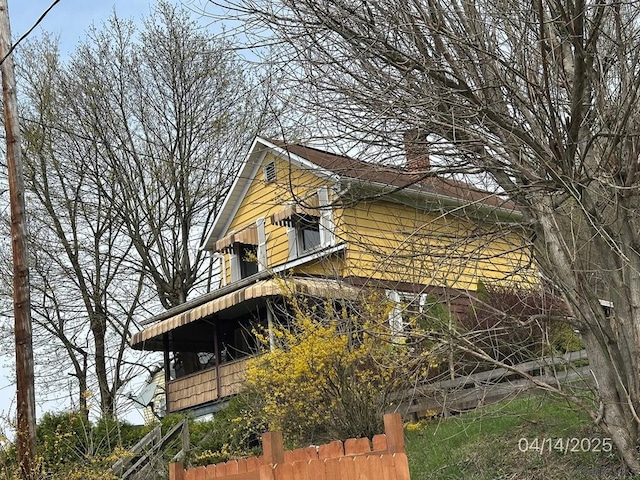 298 Lunen St, Johnstown, PA 15902 - view of side of property with fence and a chimney