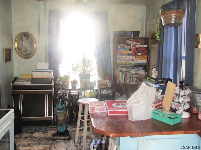 dining room featuring crown molding