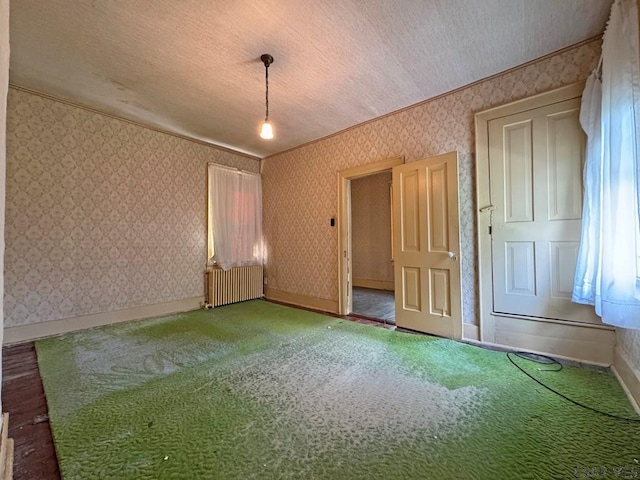 603 Woodvale Ave, Johnstown, PA 15901 - carpeted spare room featuring radiator heating unit, wallpapered walls, and a textured ceiling