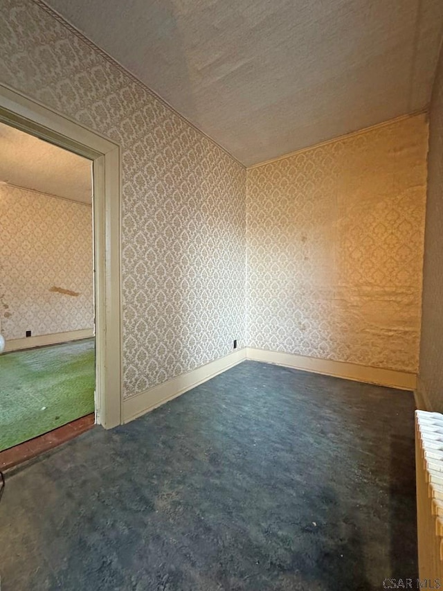 603 Woodvale Ave, Johnstown, PA 15901 - spare room with wallpapered walls, carpet floors, and a textured ceiling