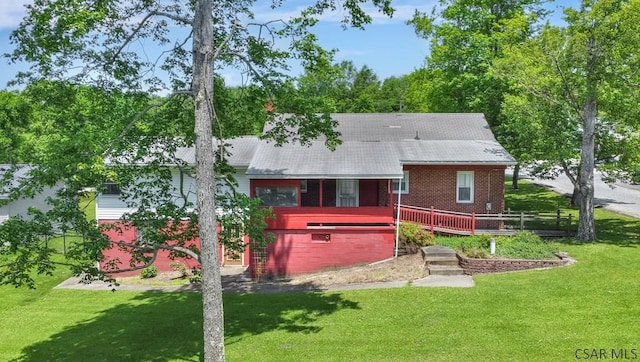 751 Pike Rd, Johnstown, PA 15909 - rear view of house featuring a lawn, a deck, and brick siding