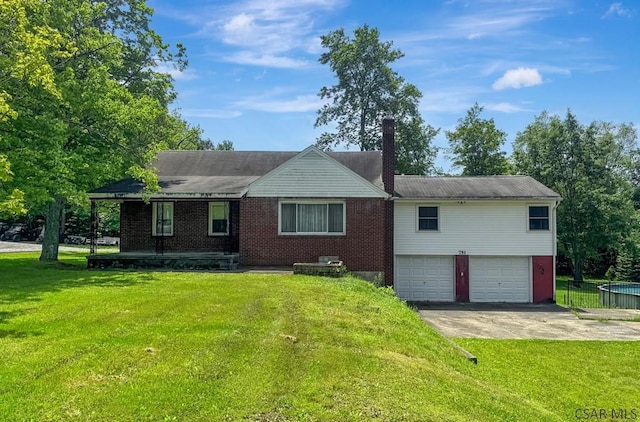 751 Pike Rd, Johnstown, PA 15909 - ranch-style house with a front lawn, concrete driveway, a garage, a chimney, and brick siding