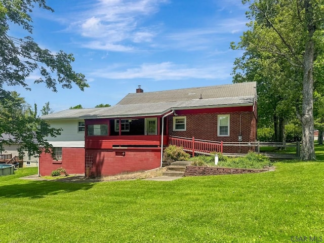 751 Pike Rd, Johnstown, PA 15909 - rear view of property with a lawn, brick siding, and a chimney