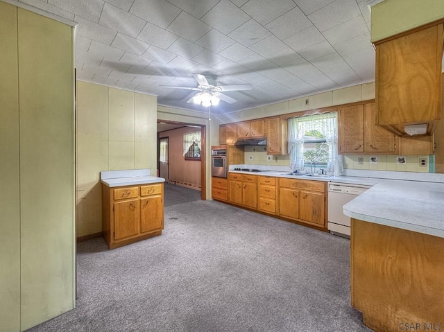 751 Pike Rd, Johnstown, PA 15909 - kitchen featuring stainless steel oven, dishwasher, light countertops, light colored carpet, and brown cabinetry