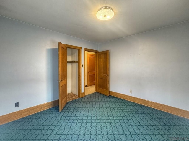 751 Pike Rd, Johnstown, PA 15909 - unfurnished bedroom with dark carpet and a closet