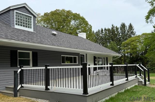 2200 Dundee Ln, Johnstown, PA 15905 - back of house with roof with shingles, a deck, and a chimney