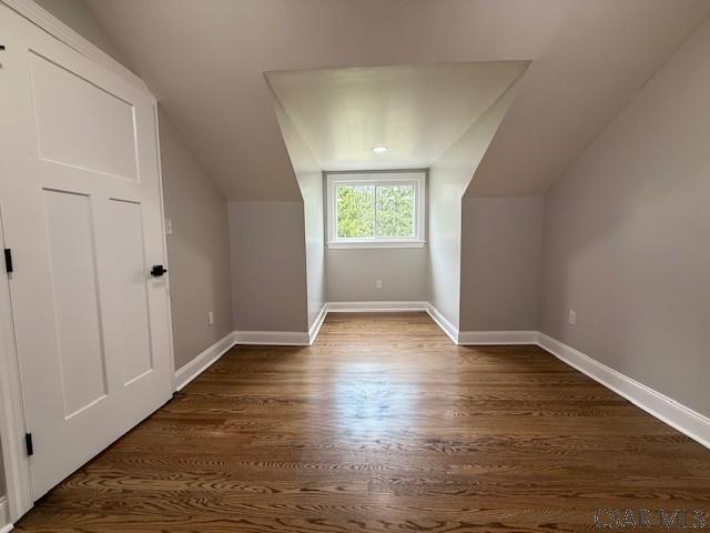 2200 Dundee Ln, Johnstown, PA 15905 - additional living space featuring vaulted ceiling, dark wood-style flooring, and baseboards