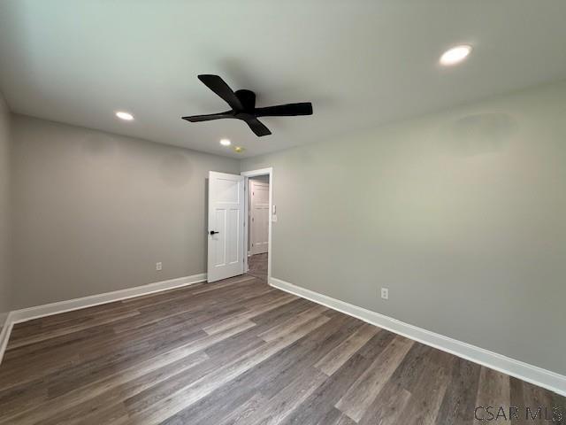2200 Dundee Ln, Johnstown, PA 15905 - unfurnished room with baseboards, recessed lighting, dark wood-style floors, and ceiling fan