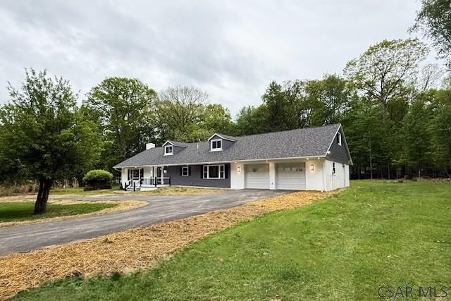2200 Dundee Ln, Johnstown, PA 15905 - view of front of house featuring a garage, asphalt driveway, and a front yard