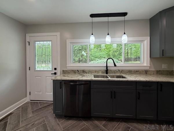 2200 Dundee Ln, Johnstown, PA 15905 - kitchen featuring dishwasher, a sink, light stone countertops, pendant lighting, and baseboards