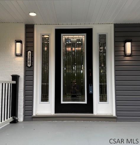2200 Dundee Ln, Johnstown, PA 15905 - view of exterior entry with a porch