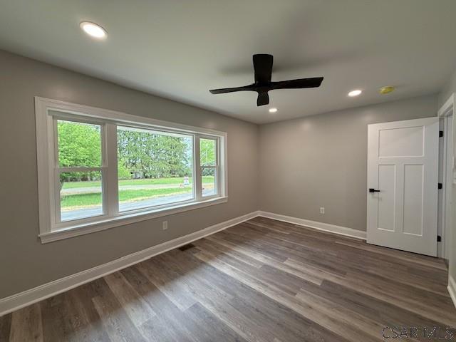 2200 Dundee Ln, Johnstown, PA 15905 - unfurnished room with baseboards, dark wood-style flooring, a ceiling fan, and recessed lighting