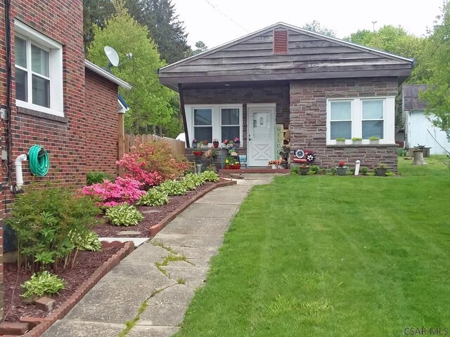 17 Grant St, Salisbury, PA 15558 - view of front of property featuring a front lawn, covered porch, and stone siding