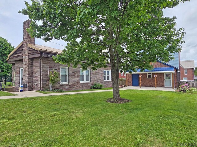 17 Grant St, Salisbury, PA 15558 - single story home with a chimney, a patio area, and stone siding