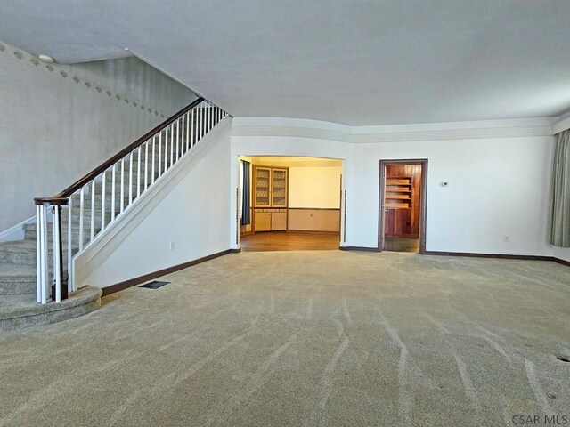 17 Grant St, Salisbury, PA 15558 - unfurnished living room featuring carpet flooring, stairway, baseboards, and ornamental molding