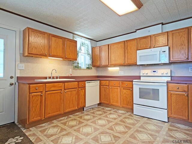 17 Grant St, Salisbury, PA 15558 - kitchen featuring white appliances, a sink, ornamental molding, brown cabinetry, and an ornate ceiling